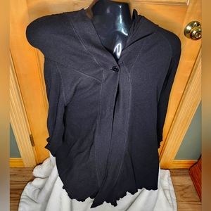 Women's hooded wrap with one button closure.